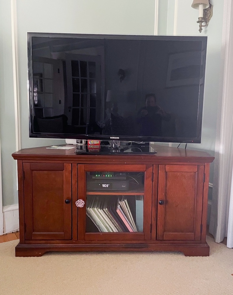 TV on a brown TV stand