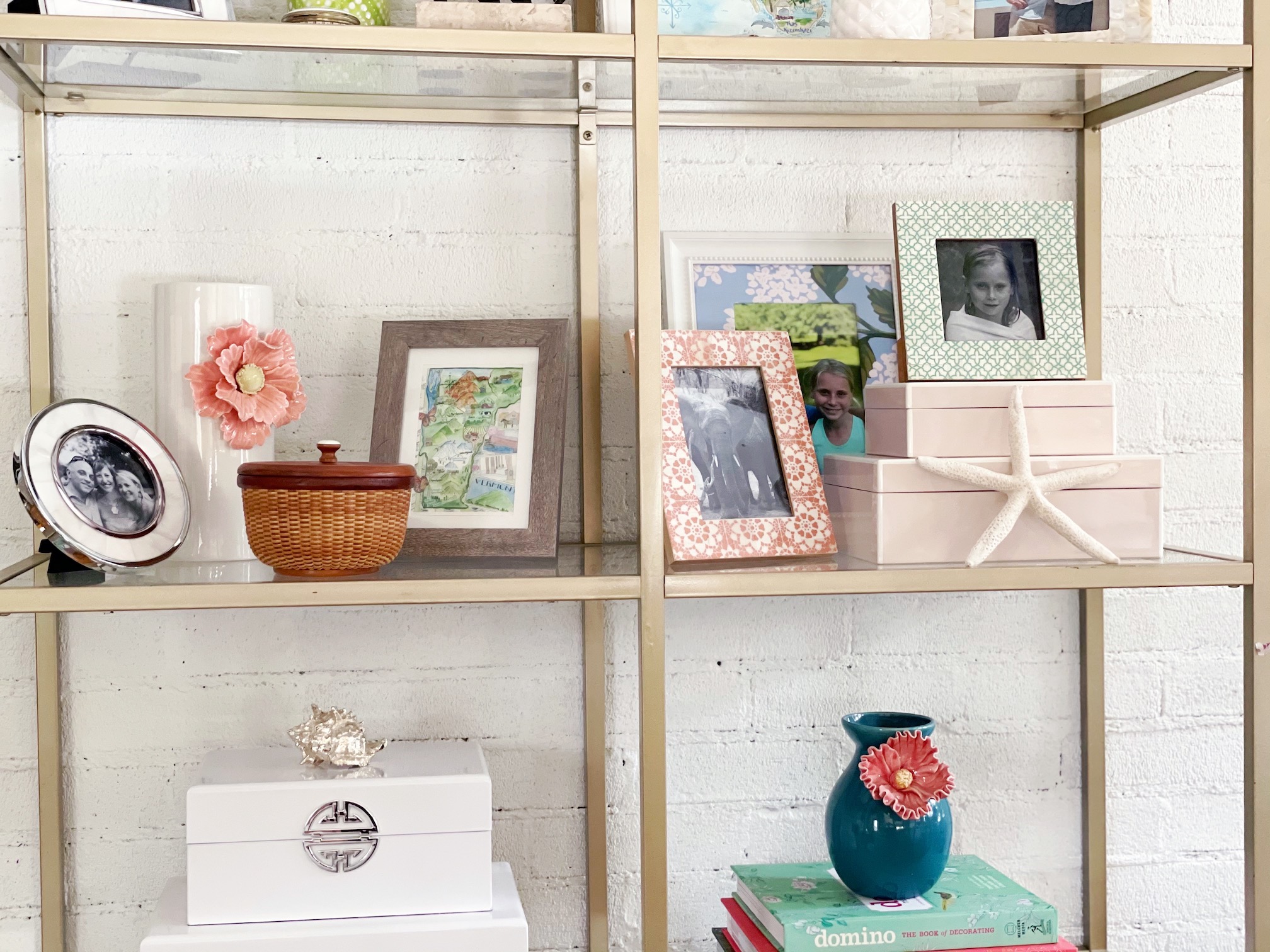 Colorful objects, picture frames and books on a Vittsjö bookcase hack